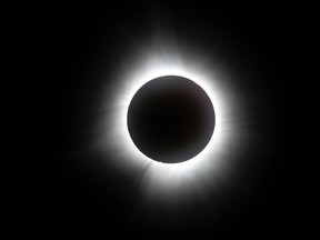 A solar eclipse is seen in this photo.