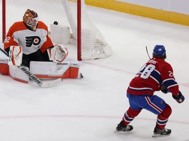 Montreal Canadiens' Christian Dvorak (28) scores on Philadelphia Flyers goaltender Ivan Fedotov