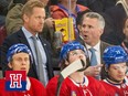 Martin St. Louis speaks to his assistant behind a bench filled with Canadiens players