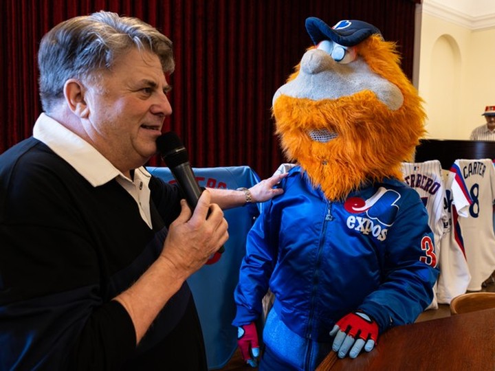  Former CHOM morning man Terry DiMonte chats with Youppi! at the launch of Aislin’s Montreal Expos: A Cartoonist’s Love Affair, at the Atwater Library in Montreal on Wednesday April 10, 2024.