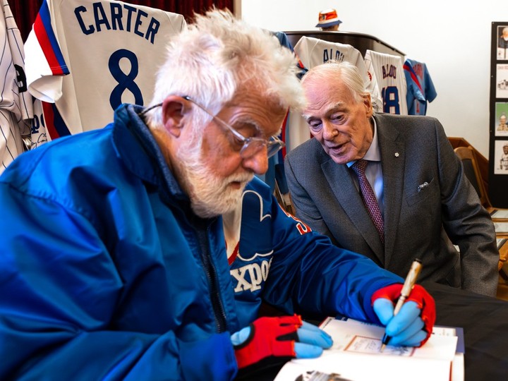  Montreal Gazette cartoonist Terry Mosher, aka Aislin, signs a copy of his new book, Montreal Expos, A Cartoonist’s Love Affair, next to Dr. David Mulder at the Atwater Library in Montreal on Wednesday April 10, 2024.
