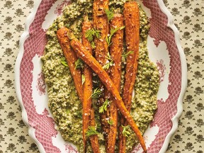 Plated roasted carrots with pesto.