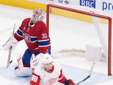Canadiens goalie Cayden Primeau throws his head back as Red Wings' Patrick Kane skates away
