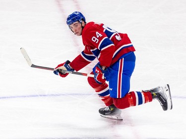 Canadiens' Logan Mailloux skates by centre ice