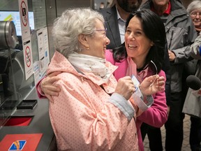 Montreal Valérie Plante greets an elderly woman at a métro stations ticket booth