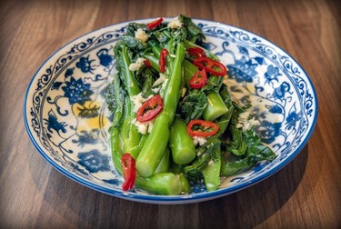Sautéed greens with ginger garlic at Oncle Lee restaurant in Mile End is seen Thursday, April 18, 2024.