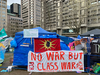 A sign outside a tent on McGill's campus reads 'No war but class war'