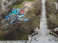 An aerial view of dozens of tents on a grassy area of the McGill University campus downtown