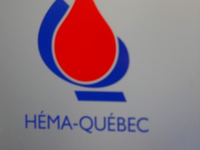 A closeup of a Héma-Québec logo.