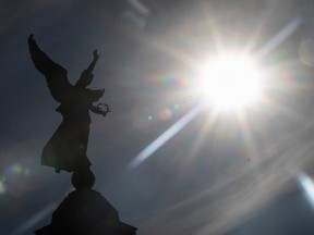 Sun over the statue of George-Etienne Cartier in Montreal