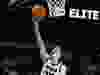 Caitlin Clark shoots a basketball under the net
