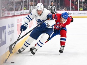 Maple Leafs' David Kampf (64) and Canadiens' Jayden Struble (47) skate after the puck during the first period at the Bell Centre on Saturday, April 6, 2024, in Montreal.