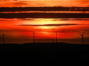Wind turbines can be seen at sunset in Gelsenkirchen, western Germany, on April 10, 2024.