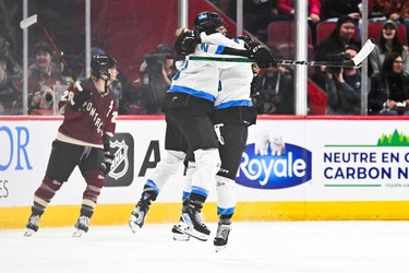Sarah Nurse #20 of Toronto celebrates her overtime goal with teammate Emma Maltais #27 in the PWHL game against Montreal at the Bell Centre on April 20, 2024 in Montreal.