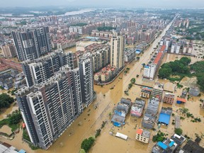 This aerial photo taken on April 22, 2024 shows a general view of flooded buildings and streets after heavy rains in Qingyuan city, in China's southern Guangdong province.