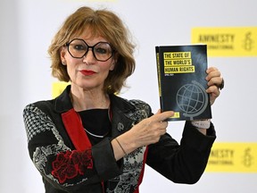 French human rights activist and Secretary General of Amnesty International Agnes Callamard shows Amnesty International's The State of the World's Human Rights report.