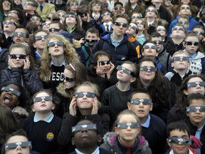Schoolchildren gather to view a partial solar eclipse in Glasgow in 2015.