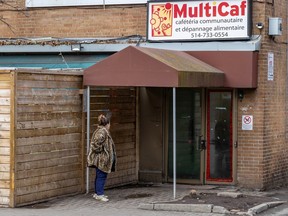 A woman waits outside MultiCaf in the Cote-des-Neiges district of Montreal last month. Multifcaf offered up space for a warming project this winter, but some neighbours have complained about how it was run by Prévention CDN-NDG.