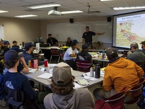 Wildfire academy students gather for instruction in a classroom, Monday, March 11, 2024, in Prescott, Ariz.