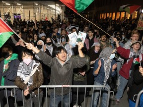 Pro-Palestinian students and activists protest against the Israel-Hamas War on the campus of New York University (NYU) in New York on April 22, 2024.