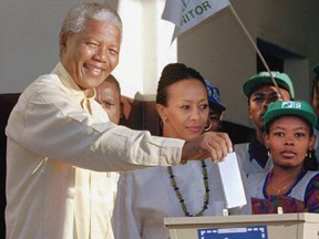 Then African National Congress leader Nelson Mandela casts his vote April 27, 1994 near Durban, South Africa, in the country's first all-race elections.