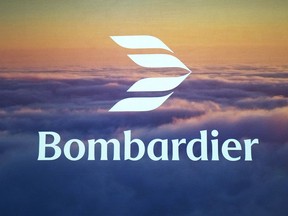 A bombardier logo in white letters is seen across a sunset sky above clouds.