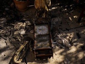 A damaged clock outside a home that came under attack during a massive Hamas invasion into Kibbutz Nir Oz, Israel is seen on Oct. 19, 2023.