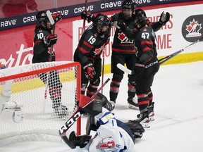 Canada's Brianne Jenner (19) celebrates her goal on Finland goaltender Sanni Ahola (1) with teammates Sarah Fillier (10), Jocelyne Larocque (3) and Jamie Lee Rattray (47) during first period hockey action at the IIHF Women's World Hockey Championship in Utica, N.Y., Thursday, April 4, 2024.