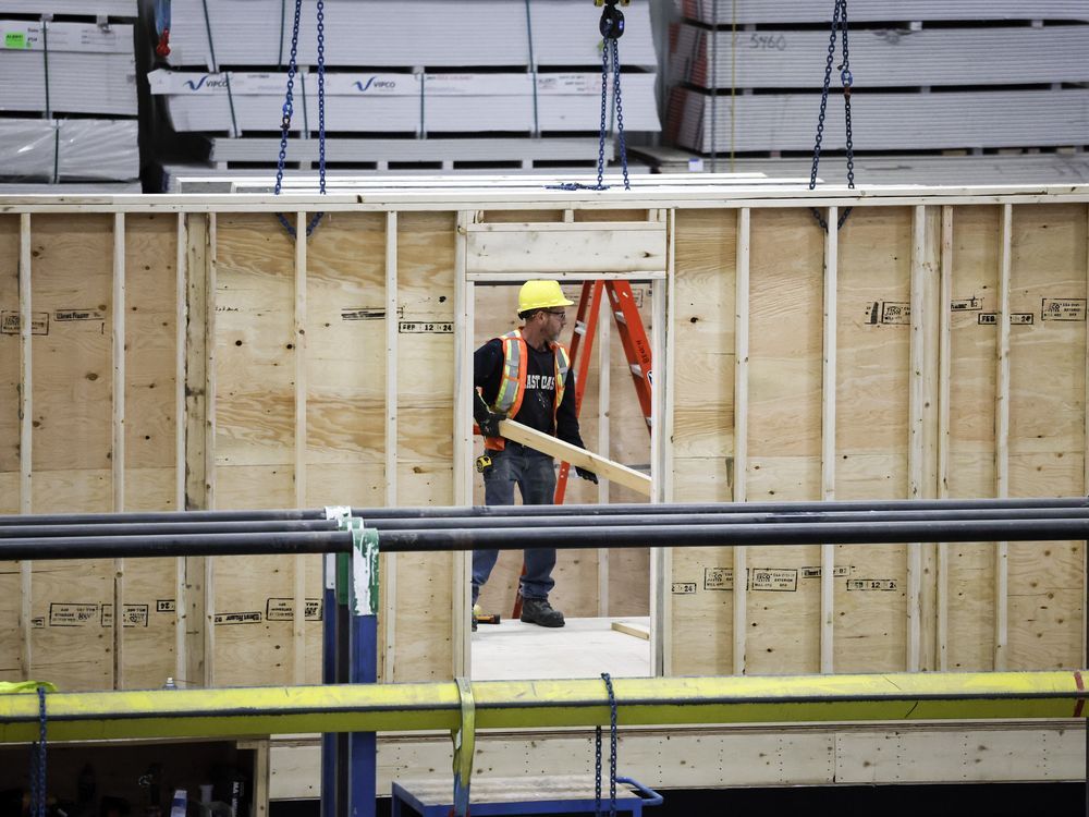 As the national housing agency continues to forecast housing start levels that probably won't be enough to meet Canada's growing demand, experts say solving the longstanding labour shortage in the construction sector will be one key to solving the issue. An employee works on a modular home component in Calgary, Friday, April 5, 2024.
