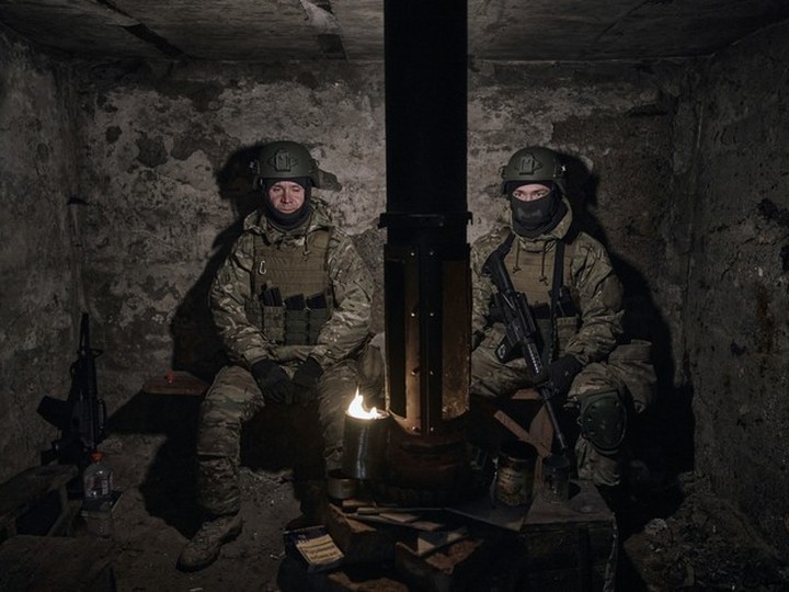  Volunteer soldiers rest in a shelter close to Bakhmut, Donetsk region, March 8, 2023.  