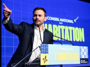 Parti Québécois Leader Paul St-Pierre Plamondon speaks at a podium