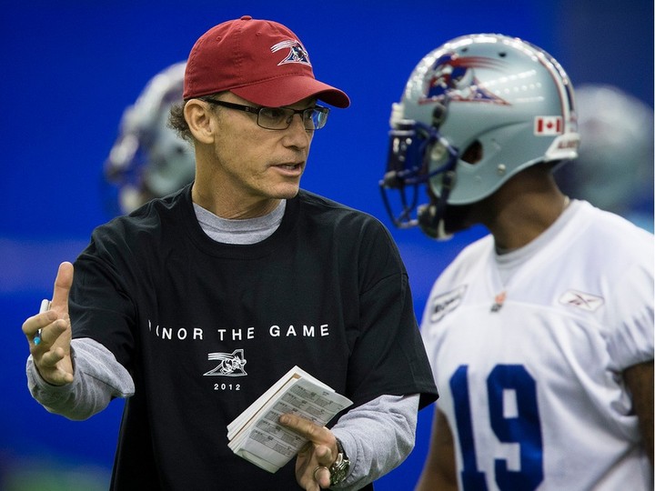  Montreal Alouettes head coach Marc Trestman, left, speaks to players during practice on Nov. 14, 2012.