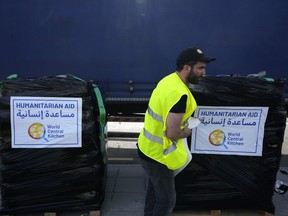 A member of the World Central Kitchen prepares a pallet with the humanitarian aid for transport to the port of Larnaca from where it will be shipped to Gaza, at a warehouse near Larnaca, Cyprus, on March 13, 2024.