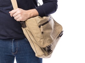 A man carrying a shoulder bag