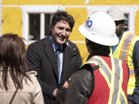 Prime Minister Justin Trudeau greets contractors following a housing announcement in Dartmouth, N.S. on Tuesday, April 2, 2024.