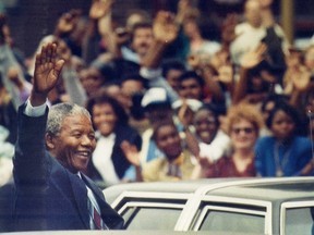 Nelson Mandela waves to Montrealers during a visit in June 1990. The promise of his African National Congress has failed under the weight of corruption and economic mismanagement.