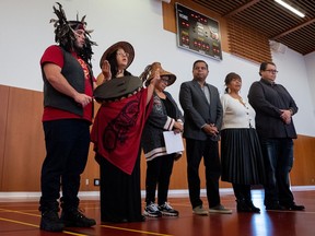 Matsqui drummer and singer Ron Francis-Modeste, left to right, and Melissa Epp, perform a song as Chief of the Matsqui Nation, Alice McKay, Minister of Crown-Indigenous Relations Gary Anandasangaree, Councillor of the Matsqui Nation Brenda Lynn Morgan, and Aboriginal Affairs of the Matsqui Nation Stanley Morgan listen during a news conference on the Matsqui First Nation in Abbotsford, B.C., on Wednesday, Feb. 21, 2024.