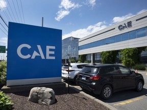 The CAE logo is seen in front of the aeropspace company's plant, Thursday, July 21, 2022 &ampnbsp;in Montreal.