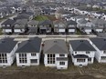 Homes under construction are seen in a suburb, Friday, Oct. 15, 2021 in Ottawa.