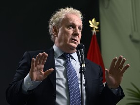 Conservative Leadership candidate Jean Charest answers questions from reporters after the third debate of the 2022 Conservative Party of Canada leadership race, in Ottawa, on Wednesday, Aug. 3, 2022.