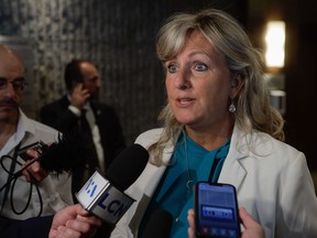 Quebec Municipal Affairs Minister Andrée Laforest answers questions during a scrum in Saguenay on Thursday September 7, 2023.