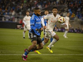 CF Montréal's Ruan, left, rushes forward with the ball