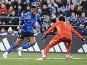CF Montréal's Mason Toye, left, gets by Orlando City goalkeeper Pedro Gallese to score during first-half MLS soccer action in Montreal, Saturday, April 20, 2024.