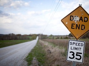 A road sign in Swanton, Vt., where the road ends at the Canadian border, on April 20, 2010.