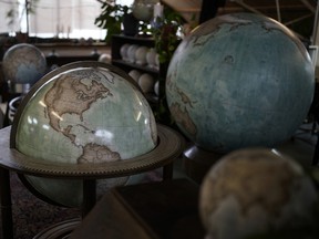 Various size of globes are displayed at a studio in London, Feb. 27, 2024.