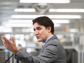 Prime Minister Justin Trudeau speaks to the media following a tour at IBM in Bromont, Que., Friday, April 26, 2024. The federal government is announcing an investment of nearly $60 million in semiconductors, a technology omnipresent in electronic devices, also used to develop artificial intelligence.