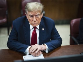 Former U.S. president Donald Trump is pictured in a Manhattan criminal court ahead of the start of jury selection in New York on April 15, 2024.