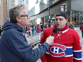 Gazette reporter Brendan Kelly, left, is seen holding a microphone in front of Habs fan Jacob Pearson, who is sporting a red Canadiens jersey, outside the Bell Centre on Tuesday, April 9.