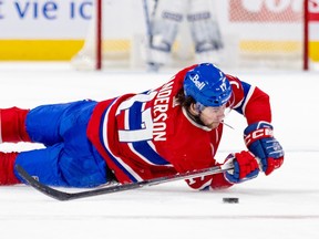 Canadiens' Josh Anderson is seen flat on his stomach trying to play the puck with his stick during a game in January.
