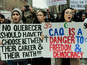 Women protest against Bill 21 in Montreal in April 2019. The supposed secularism bill does nothing to prevent proselytizing in the classroom, Toula Drimonis writes.